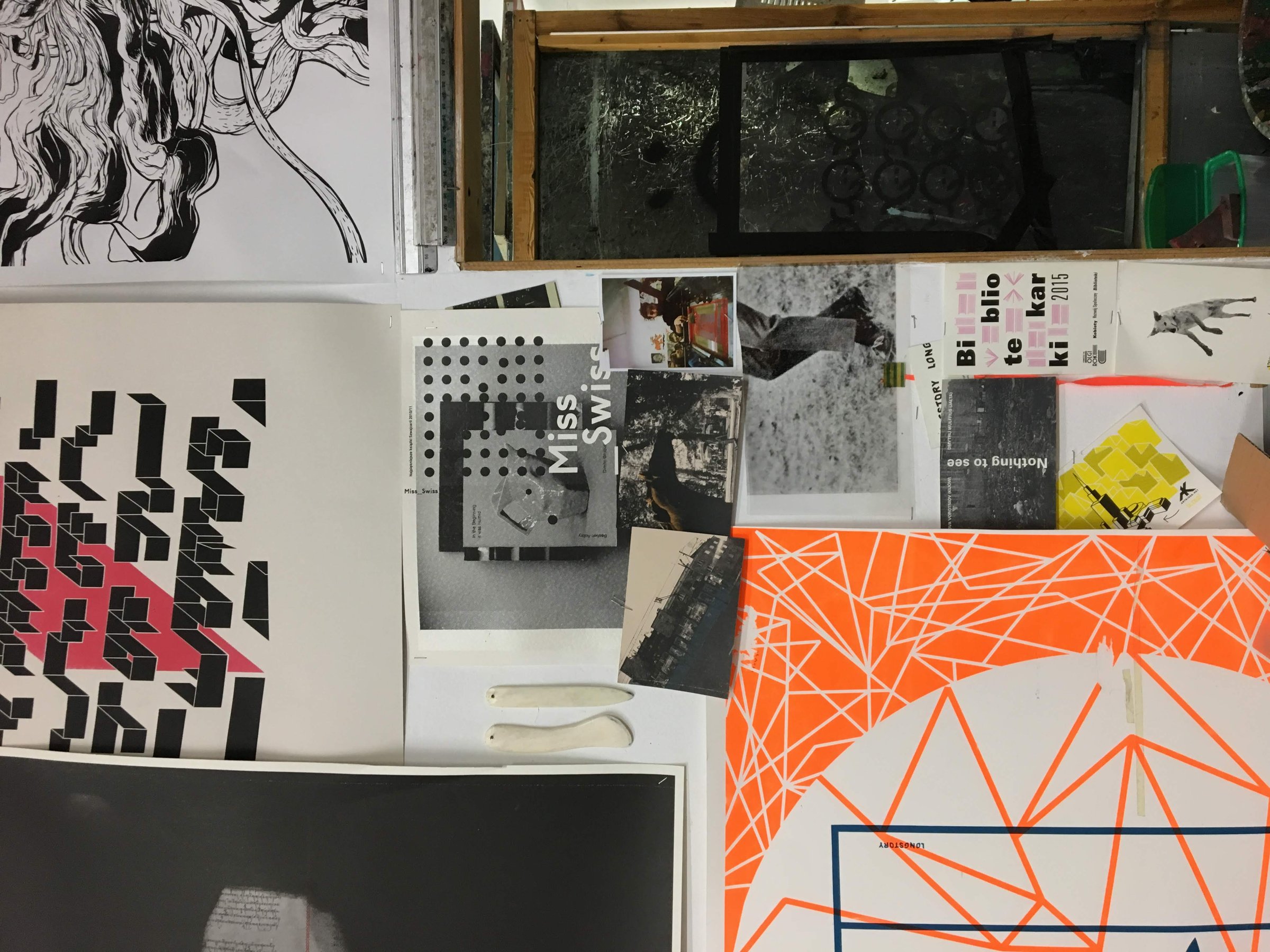 More of the studio wall: posters, prints, postcards and photos pinned up together.