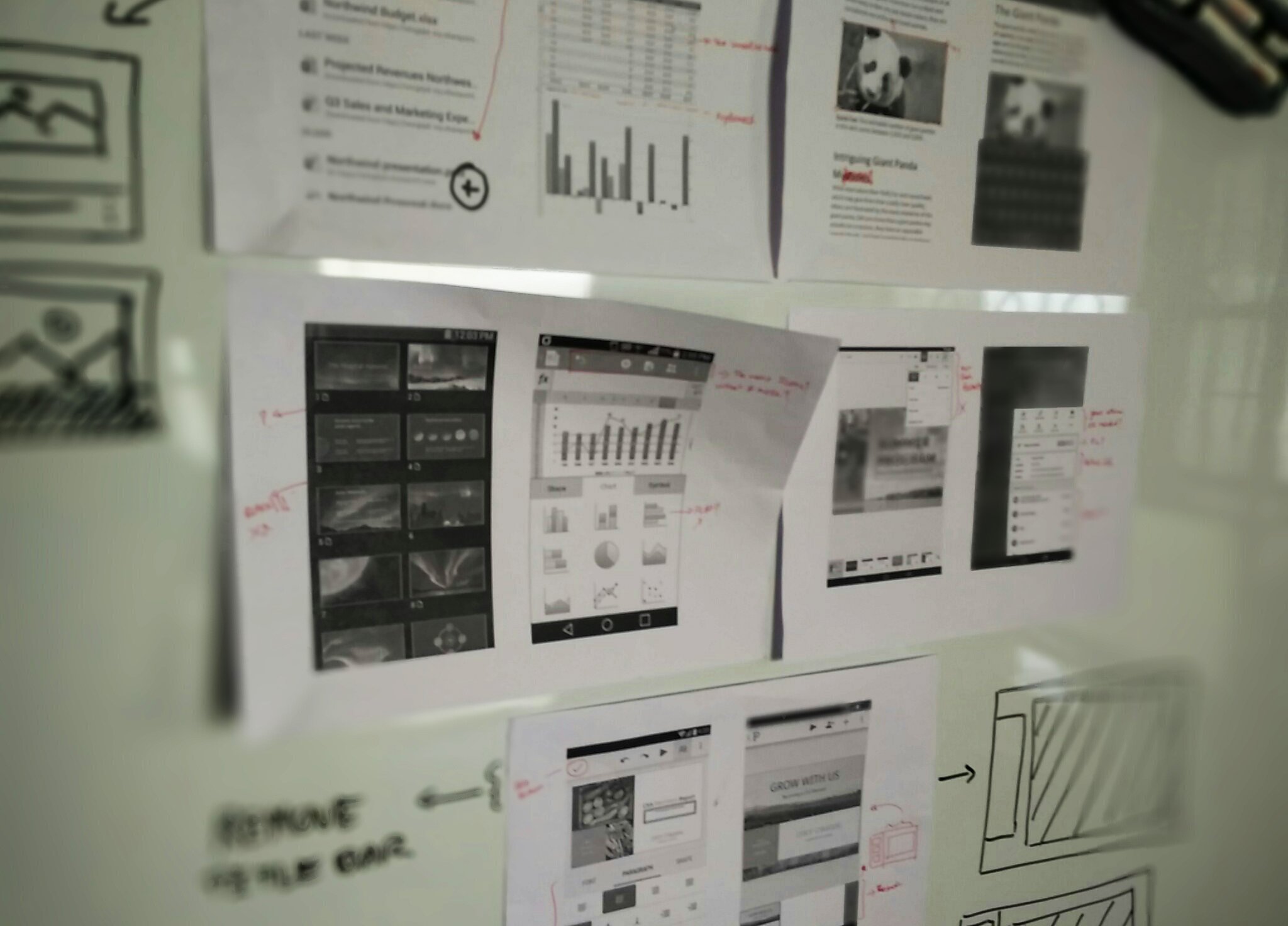 Whiteboard analysis with competitor app teardowns, user pain point notes, and mobile wireframes